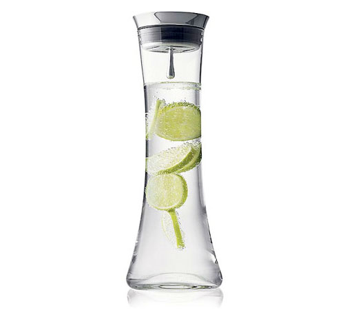 A beautiful looking water jug which holds back ice cubes when you pour out water